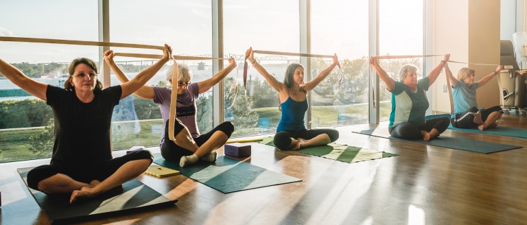 group doing shoulder and chest stretches