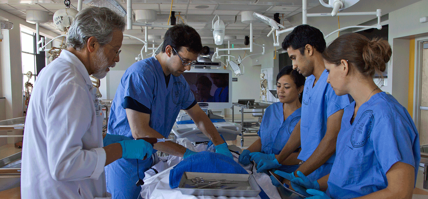 a group of medical professionals surrounding a patient in a surgery suite